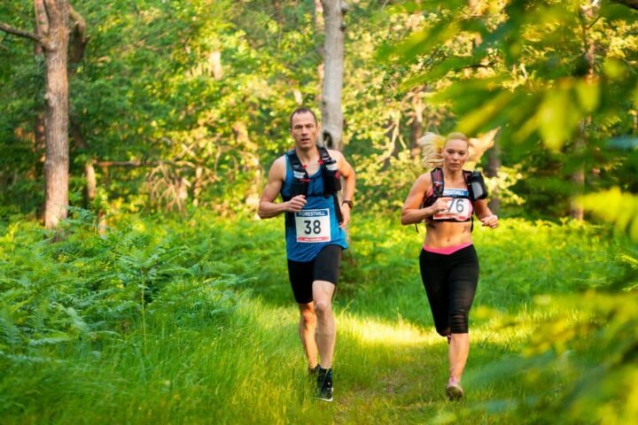 Man and woman running in ultra-marathon race